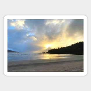 Sunshine bursting through the clouds at the sandy beach Sticker